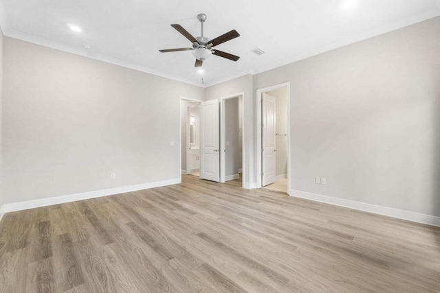 unfurnished bedroom featuring ceiling fan, ornamental molding, ensuite bath, and light hardwood / wood-style flooring