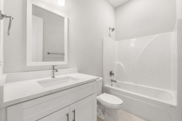 full bathroom with shower / bathing tub combination, vanity, and toilet