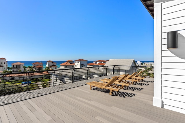 wooden deck featuring a water view