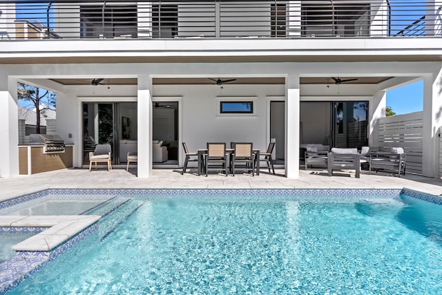 view of pool with outdoor lounge area, a patio, ceiling fan, and a grill