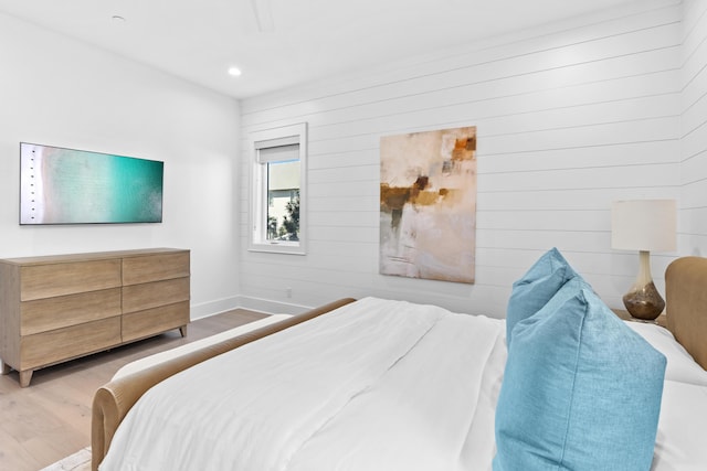 5050 W County Highway 30a, Santa Rosa Beach, FL 32459 - bedroom featuring wood walls, wood finished floors, baseboards, and recessed lighting