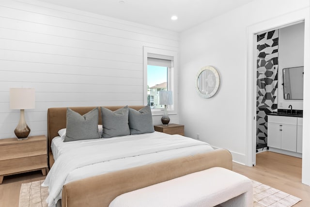 5050 W County Highway 30a, Santa Rosa Beach, FL 32459 - bedroom with recessed lighting, light wood-type flooring, and a sink