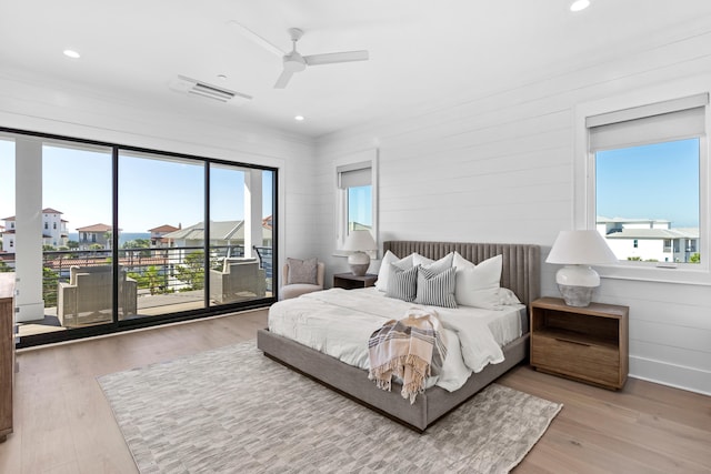 bedroom with access to exterior, ceiling fan, and light hardwood / wood-style floors