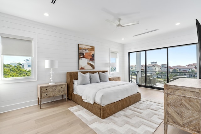 5050 W County Highway 30a, Santa Rosa Beach, FL 32459 - bedroom featuring light wood-style flooring, access to outside, baseboards, and multiple windows
