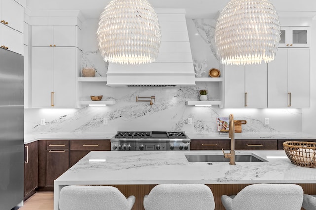 5050 W County Highway 30a, Santa Rosa Beach, FL 32459 - kitchen featuring a sink, stainless steel refrigerator, open shelves, custom exhaust hood, and dark brown cabinetry