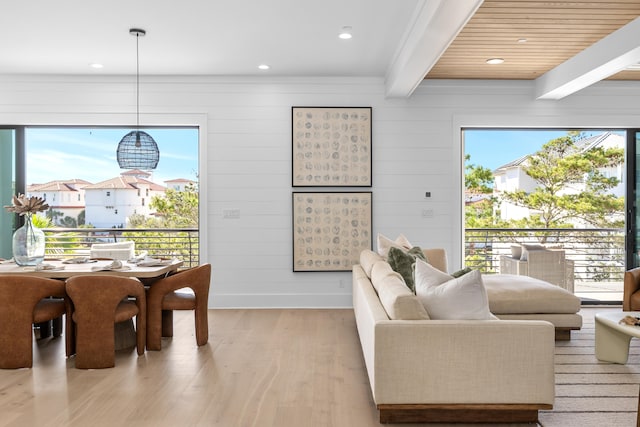 living room featuring beam ceiling, wood ceiling, and light hardwood / wood-style floors