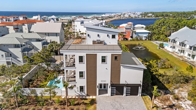 birds eye view of property with a water view