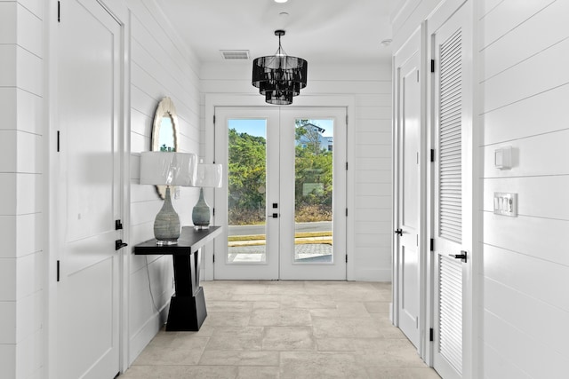 5050 W County Highway 30a, Santa Rosa Beach, FL 32459 - doorway to outside with stone finish flooring, a notable chandelier, french doors, and visible vents