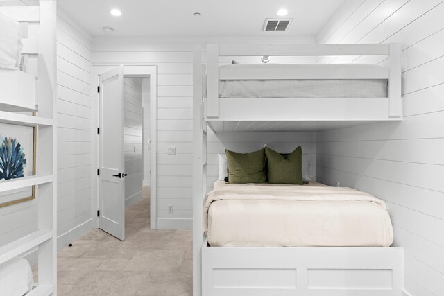 5050 W County Highway 30a, Santa Rosa Beach, FL 32459 - bedroom with wooden walls, visible vents, and recessed lighting