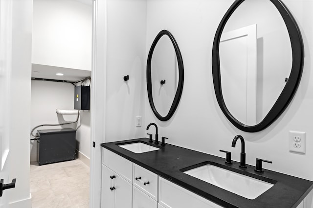 bathroom with tile patterned flooring and vanity