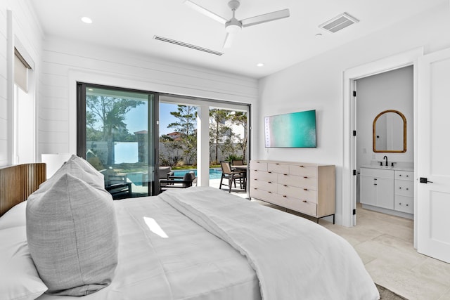 bedroom with ceiling fan, sink, access to outside, and multiple windows