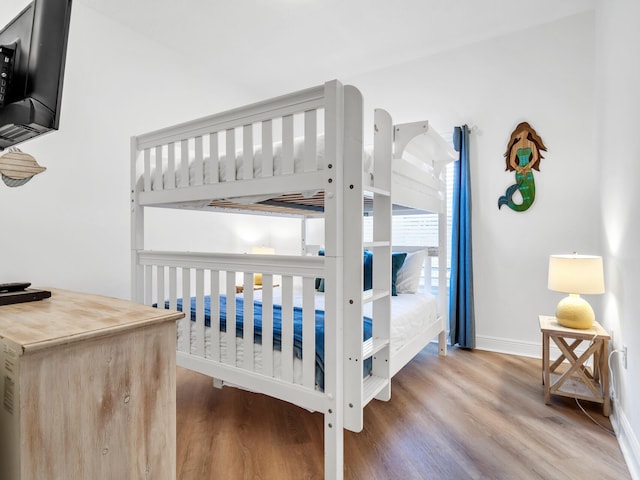 bedroom with hardwood / wood-style floors