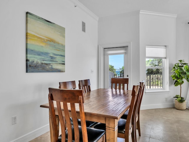 dining area with crown molding