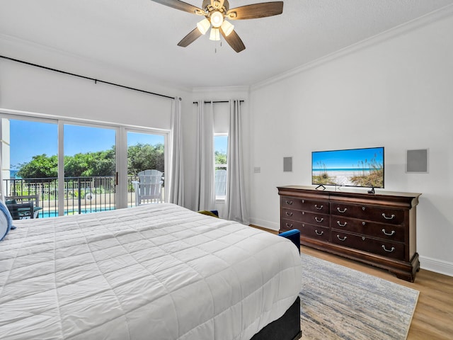 bedroom featuring access to exterior, crown molding, light hardwood / wood-style floors, and ceiling fan