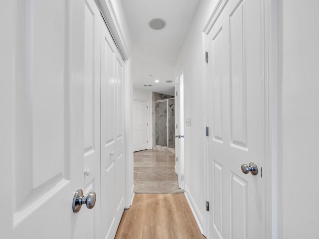 hallway featuring light hardwood / wood-style flooring