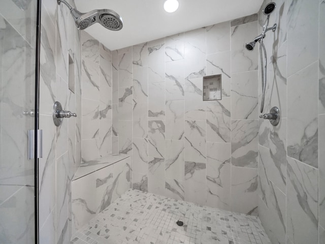 bathroom featuring tiled shower