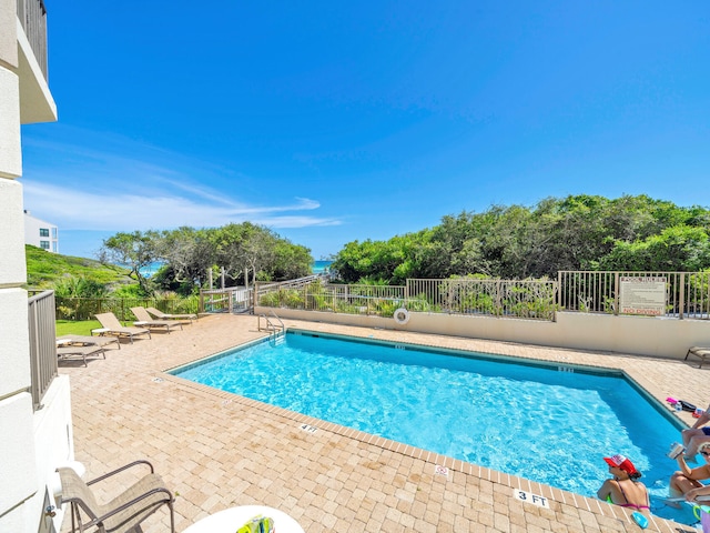 view of pool featuring a patio area