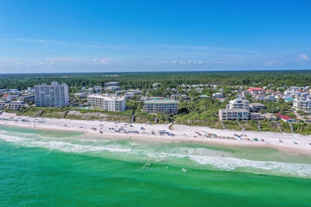 bird's eye view featuring a water view and a beach view