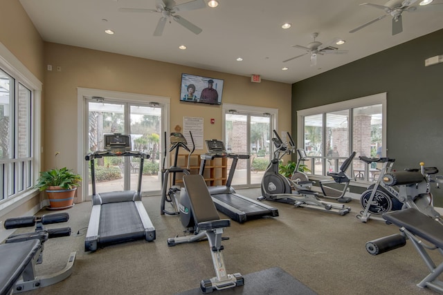 exercise room with ceiling fan and a wealth of natural light