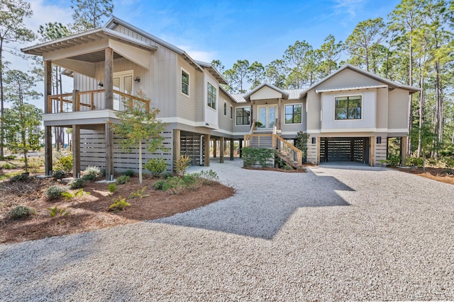 view of front of home featuring covered porch and a carport