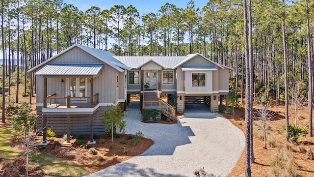 view of front of property with covered porch and a carport