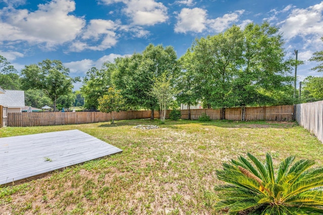 view of yard with a wooden deck