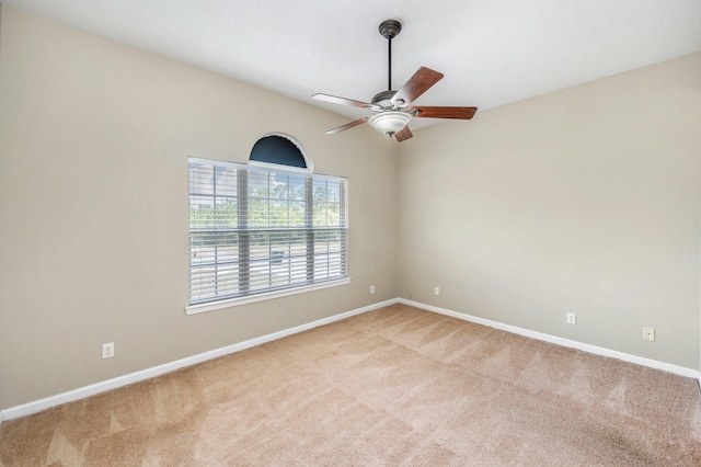 carpeted empty room with ceiling fan