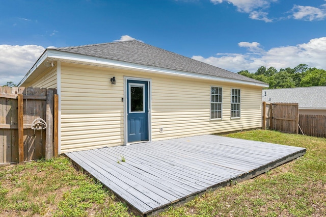 back of property featuring a wooden deck