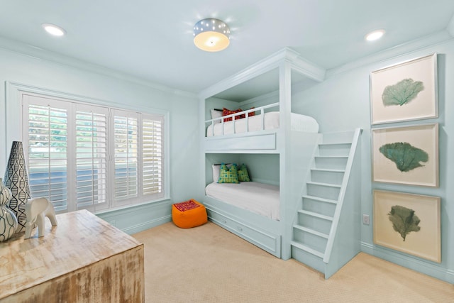 carpeted bedroom with ornamental molding