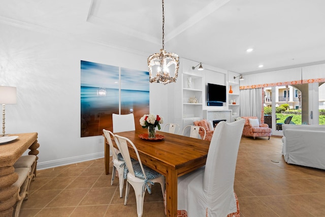 dining space featuring tile patterned floors, built in features, and ornamental molding