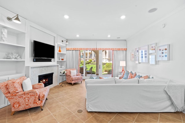 living room with built in shelves and crown molding