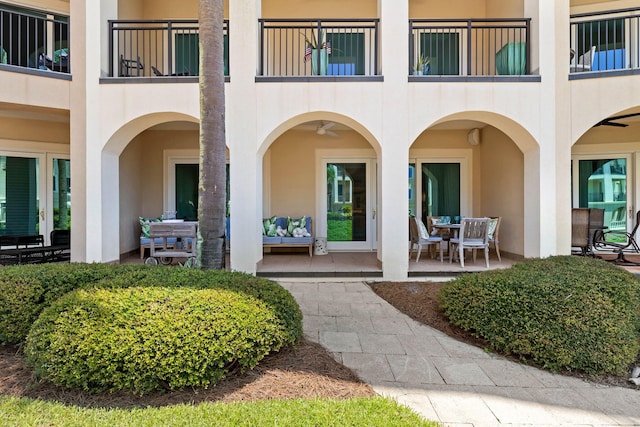 view of exterior entry featuring a patio