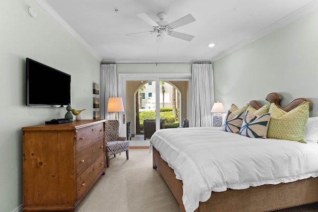 carpeted bedroom featuring access to exterior, ceiling fan, and crown molding