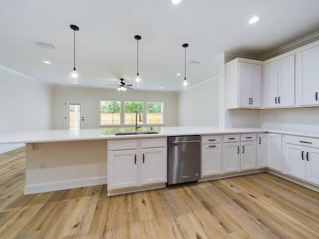 kitchen with white cabinetry, ceiling fan, sink, and stainless steel dishwasher