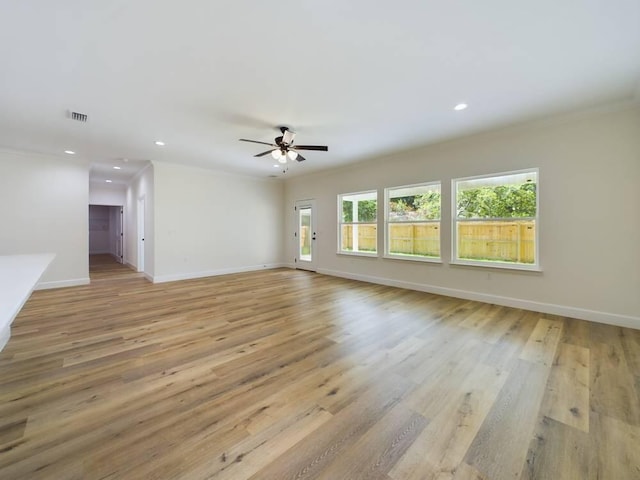 interior space featuring light hardwood / wood-style floors, ceiling fan, and crown molding