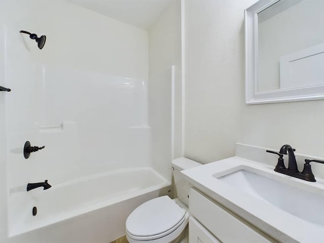 full bathroom featuring tub / shower combination, vanity, and toilet