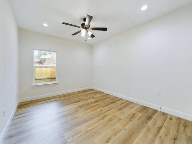 unfurnished room featuring light hardwood / wood-style floors and ceiling fan