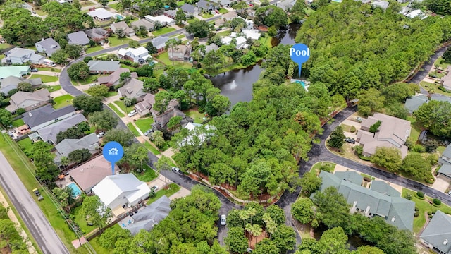 bird's eye view featuring a water view and a residential view