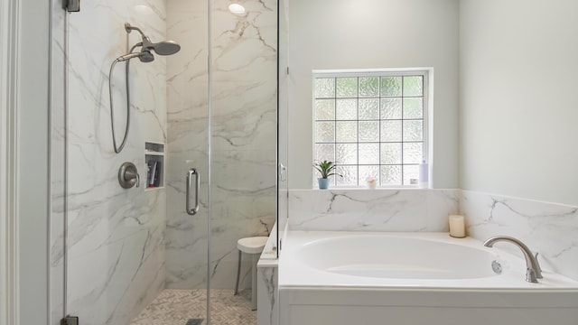 full bath with a garden tub and a marble finish shower