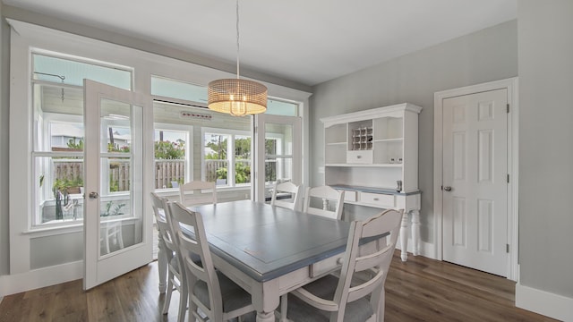 dining room with dark hardwood / wood-style flooring