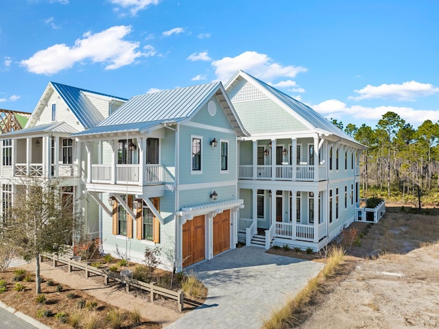 view of front of house featuring a porch and a garage