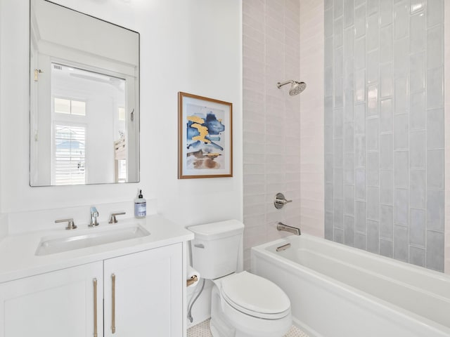 full bathroom with vanity, toilet, and tiled shower / bath