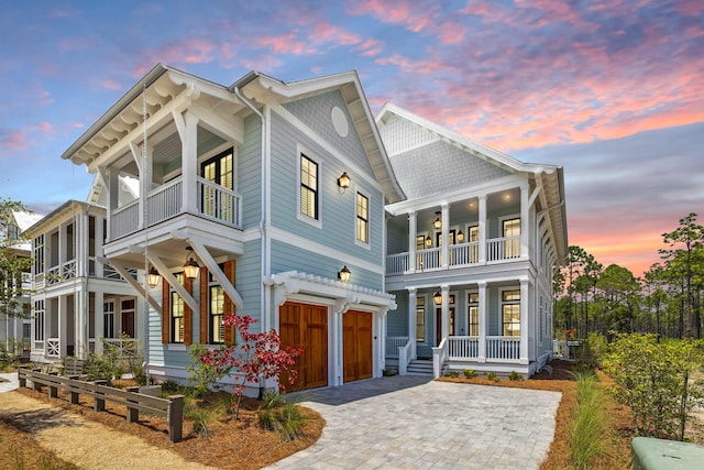 220 Climbing Rose Way, Santa Rosa Beach, FL 32459 - view of front of home featuring a balcony, covered porch, an attached garage, and decorative driveway