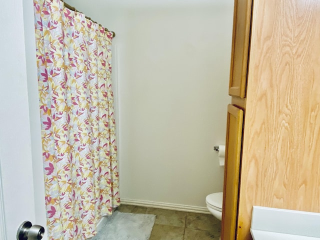 bathroom featuring toilet