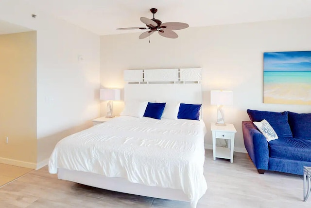 bedroom with ceiling fan and light wood-type flooring