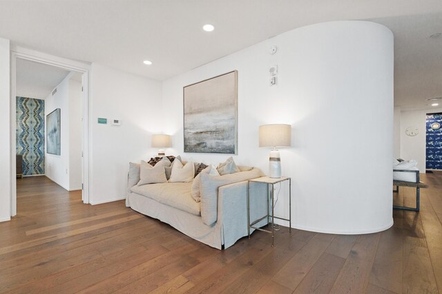 living room with dark hardwood / wood-style flooring