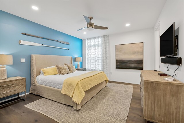 bedroom featuring ceiling fan and dark hardwood / wood-style flooring