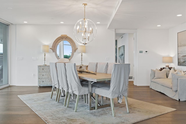 dining room featuring dark hardwood / wood-style flooring and a chandelier