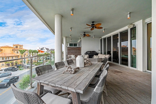 exterior space featuring ceiling fan and a grill