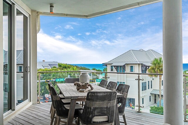 wooden deck featuring a water view